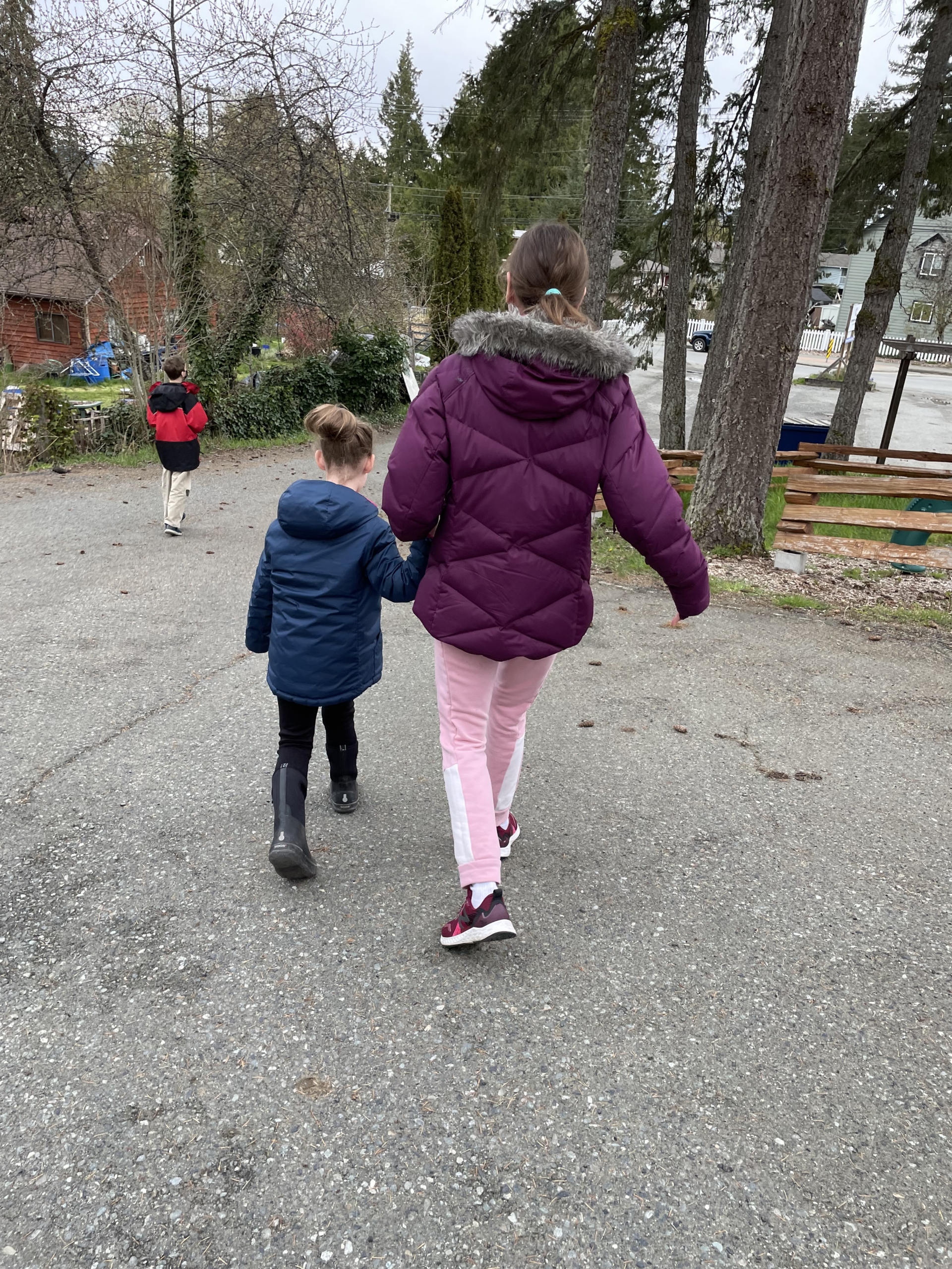 kirsten and a friend holding hands and walking